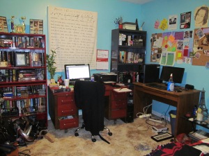 My red and wood desk, and my husband's desk. with bookcases...